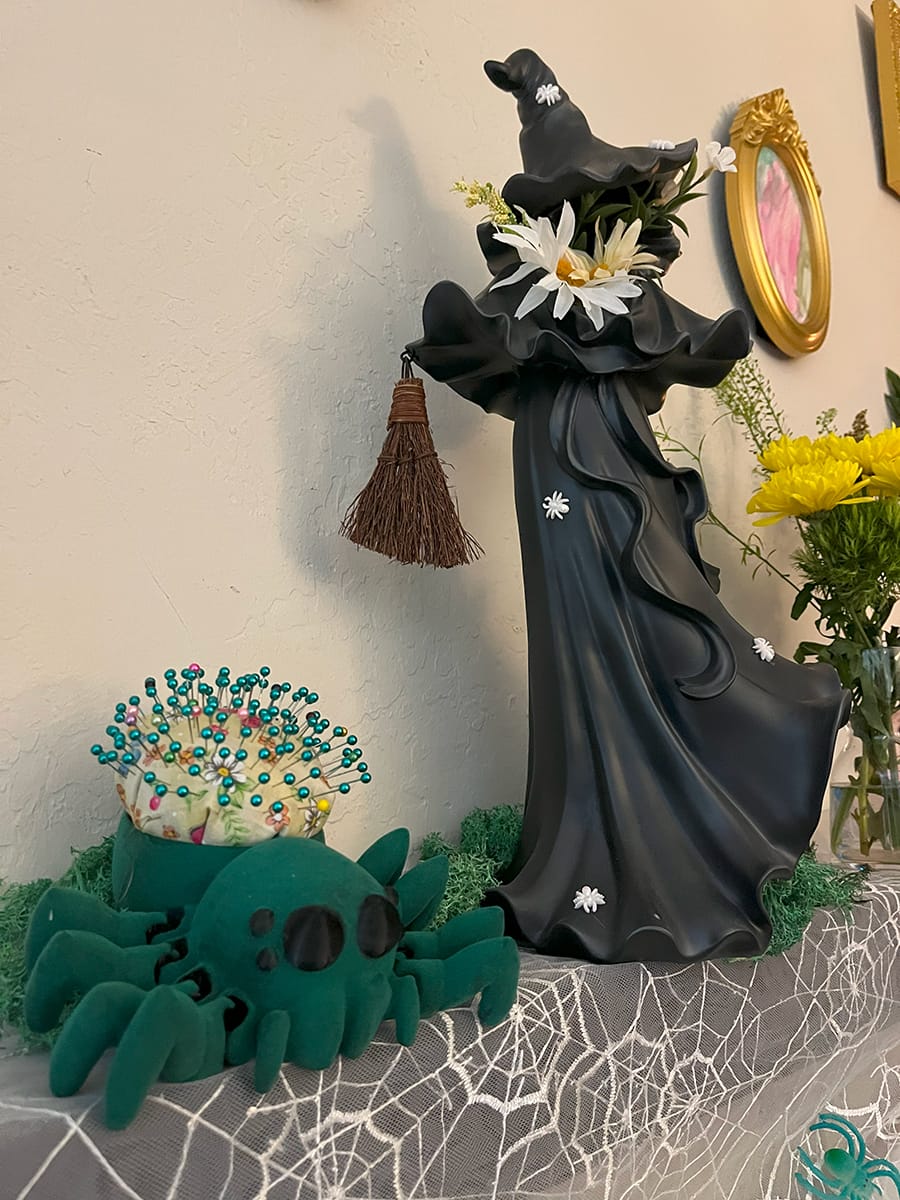 pincushion and witch on spidery spring mood mantle