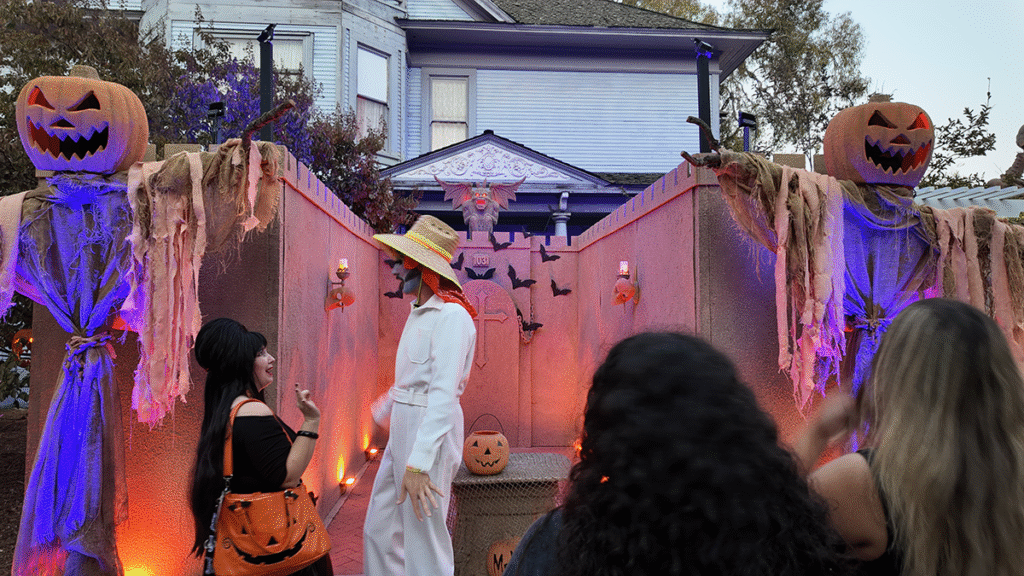 Elvira paying compliments to Mr. He on their Haunted Sandcastle at Creep It Real OC 2025