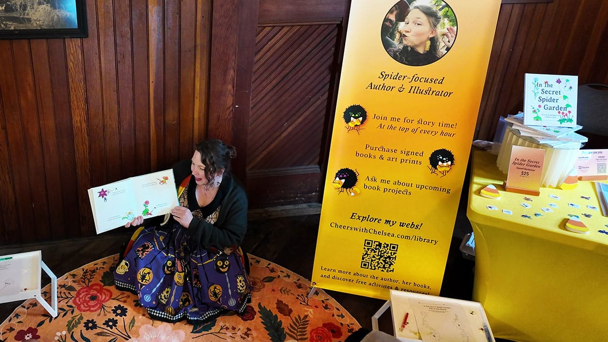reading to crowds while vending